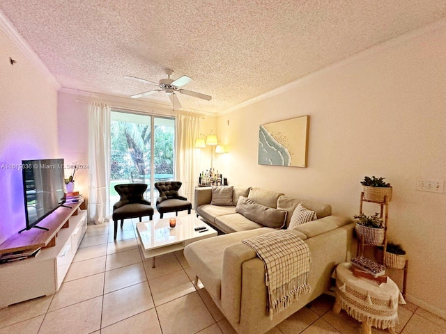 tiled living room featuring ceiling fan, ornamental molding, and a textured ceiling