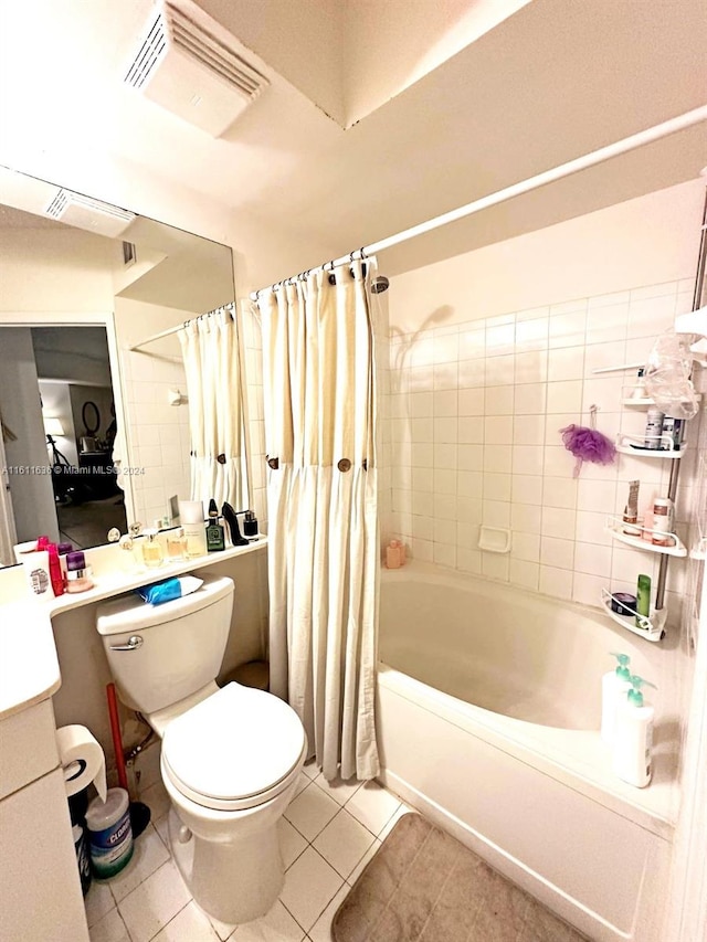 full bathroom featuring tile patterned floors, vanity, shower / bath combination with curtain, and toilet