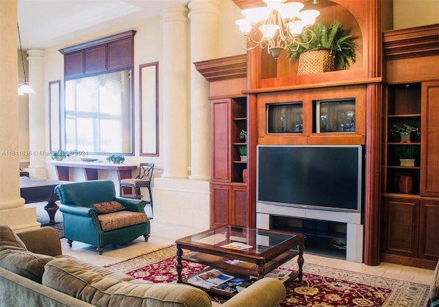 tiled living room featuring decorative columns and a notable chandelier