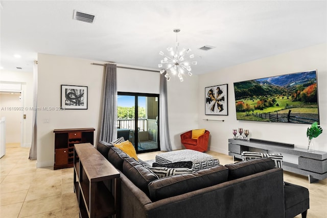 living room featuring light tile flooring and an inviting chandelier