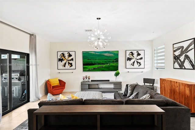 tiled living room with an inviting chandelier