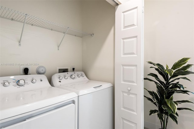 laundry room featuring washer and dryer, hookup for a washing machine, and electric dryer hookup