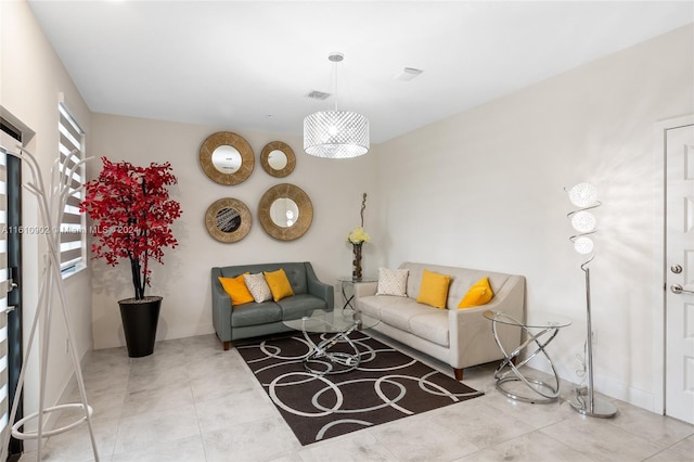 living room featuring light tile floors