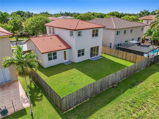 back of house featuring a yard