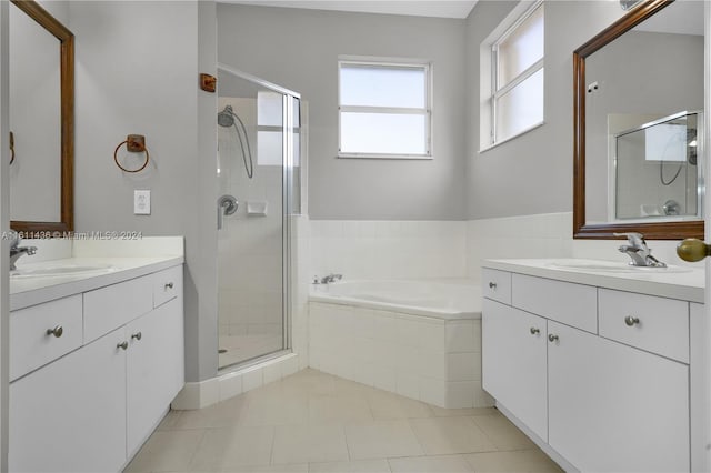 bathroom featuring tile patterned flooring, vanity, and independent shower and bath