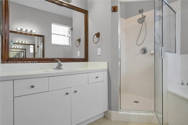 bathroom featuring shower with separate bathtub and vanity