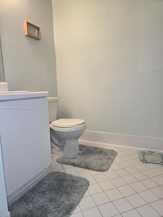 bathroom featuring tile patterned flooring and toilet