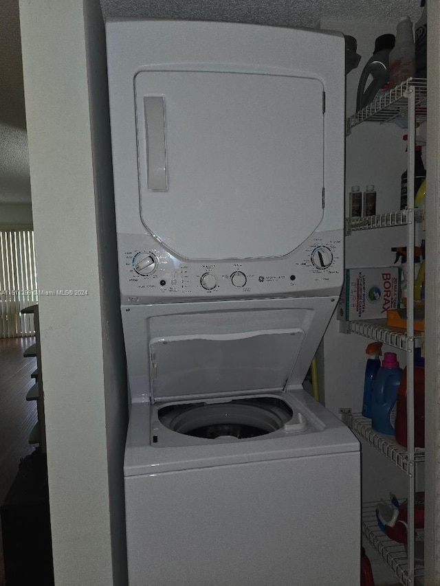 laundry area featuring stacked washer and dryer