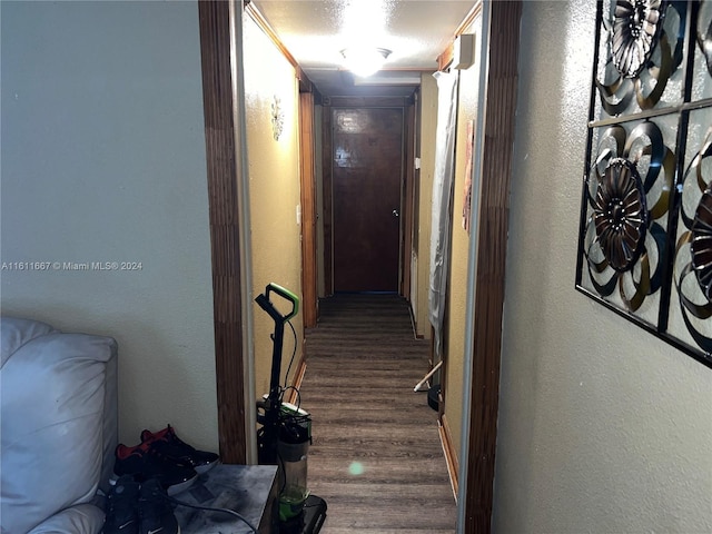 corridor with wood-type flooring