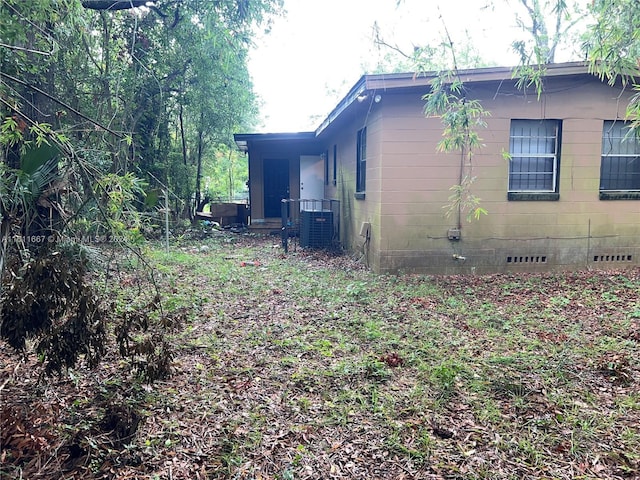 view of side of property with central AC