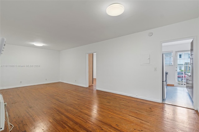 empty room featuring hardwood / wood-style flooring