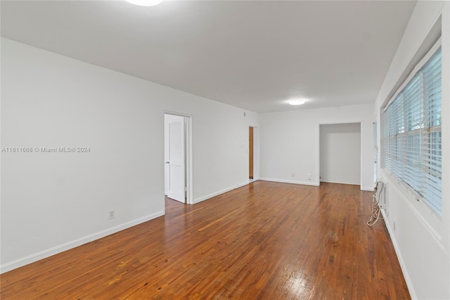 unfurnished room featuring hardwood / wood-style floors