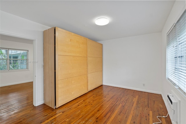 unfurnished bedroom featuring hardwood / wood-style flooring