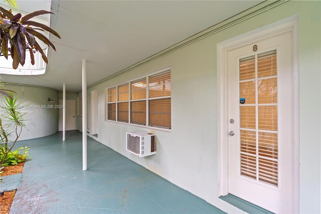 view of patio / terrace with a wall unit AC