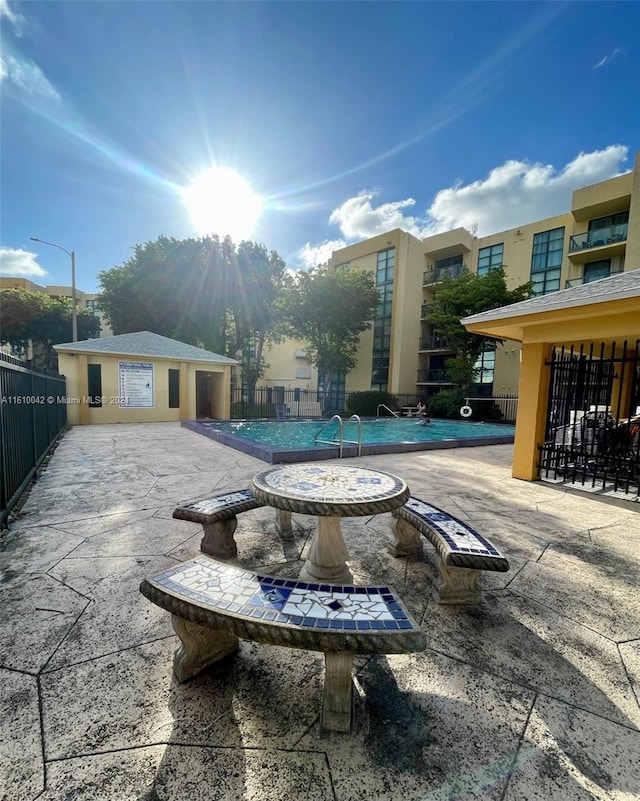 view of swimming pool featuring a patio area