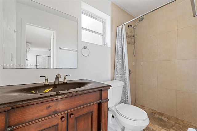 bathroom with walk in shower, vanity, and toilet