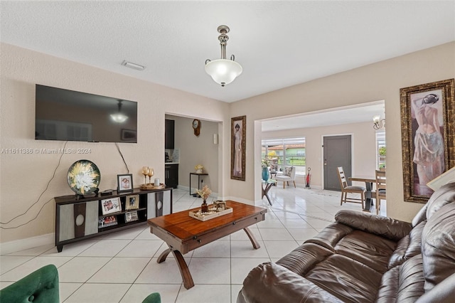 living room featuring light tile floors