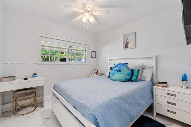 tiled bedroom with ceiling fan