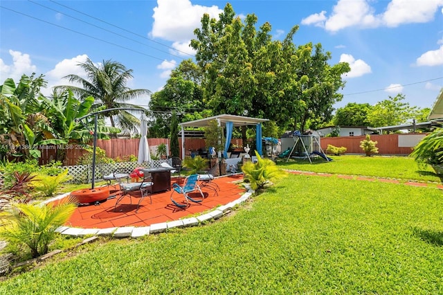 view of yard featuring a patio and a playground