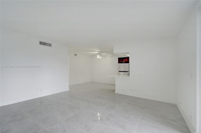 unfurnished room featuring ceiling fan