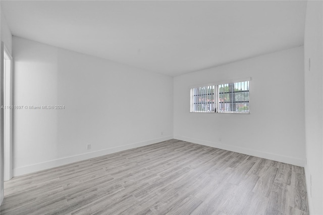 unfurnished room featuring light hardwood / wood-style flooring