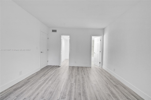 unfurnished room featuring light hardwood / wood-style floors