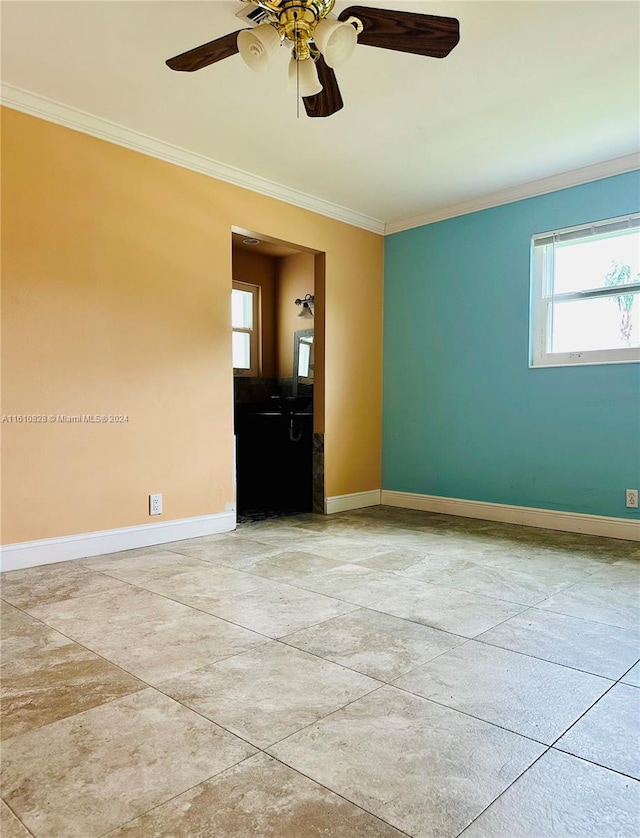 unfurnished room featuring ornamental molding and ceiling fan