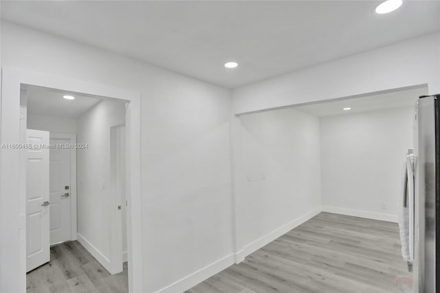 hallway with light wood-type flooring