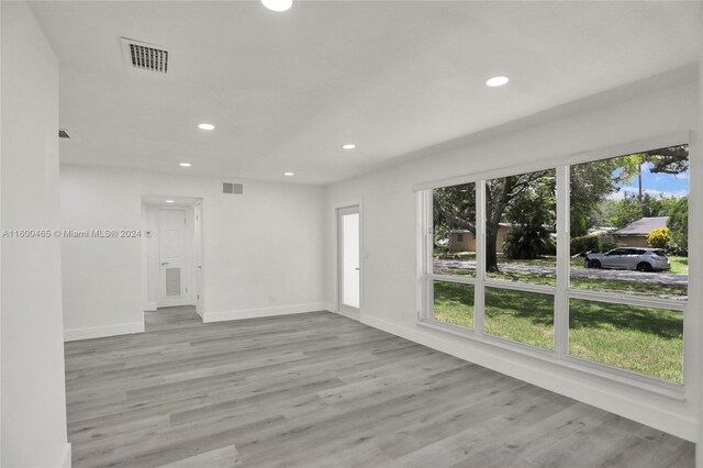 unfurnished living room featuring hardwood / wood-style floors