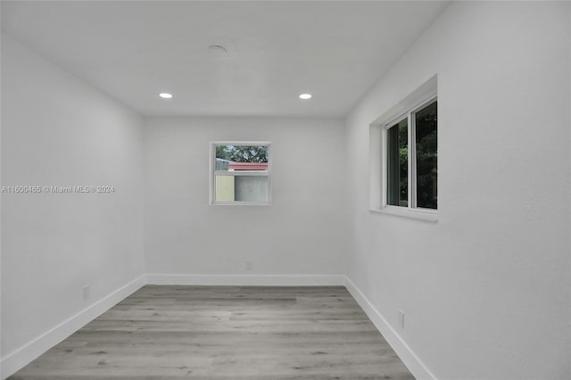 spare room with light hardwood / wood-style flooring