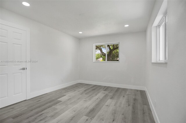 unfurnished room featuring light hardwood / wood-style floors