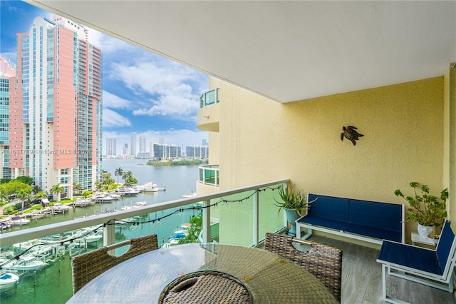 balcony featuring a water view