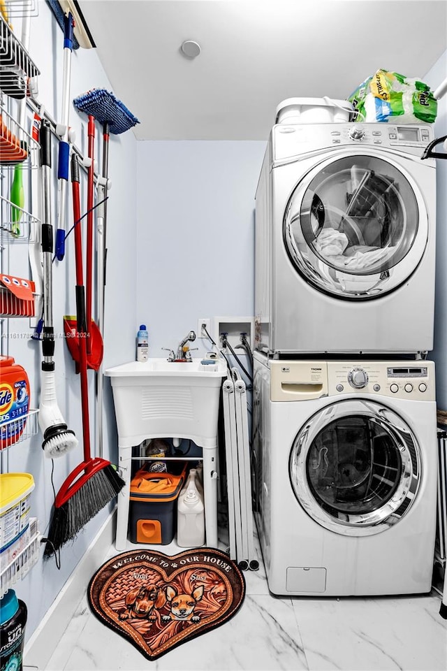 laundry room with stacked washing maching and dryer and washer hookup