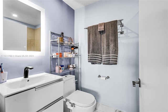 bathroom with oversized vanity and toilet