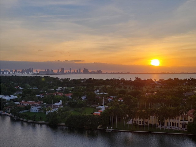 exterior space featuring a water view and a city view