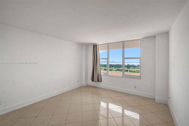 empty room with light tile patterned floors