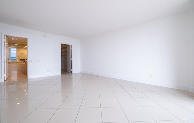 empty room featuring light tile patterned floors