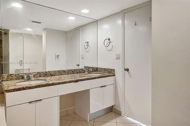 bathroom with tile patterned floors, toilet, and vanity