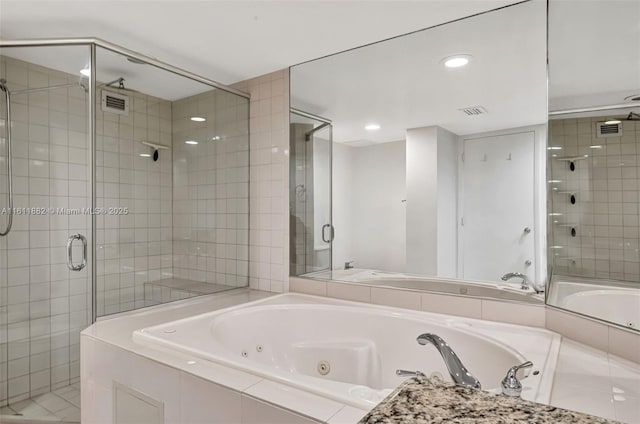 full bathroom featuring visible vents, a stall shower, and a jetted tub