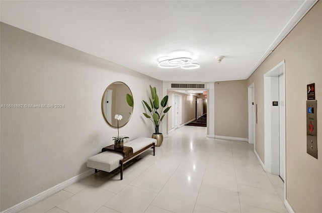 hallway with light tile patterned flooring