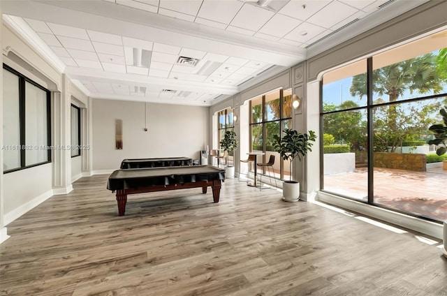 rec room featuring wood finished floors, visible vents, and baseboards