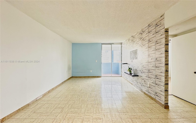 empty room featuring a textured ceiling