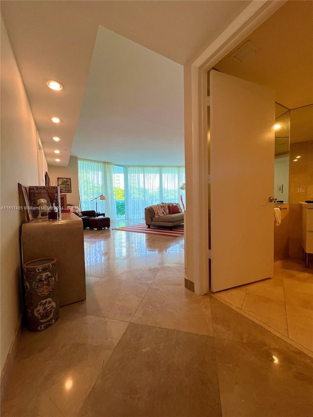 hallway with light tile patterned flooring