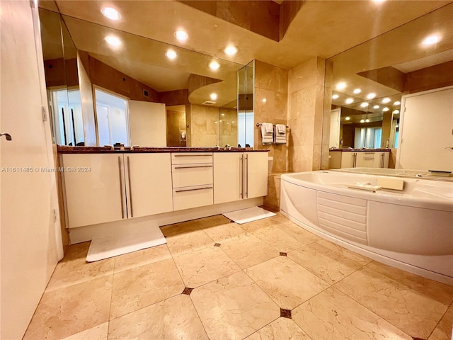 bathroom featuring vanity, independent shower and bath, and tile walls