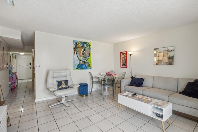 tiled living room with a textured ceiling