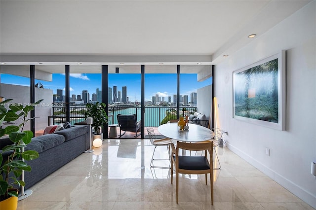 dining area with expansive windows and a wealth of natural light