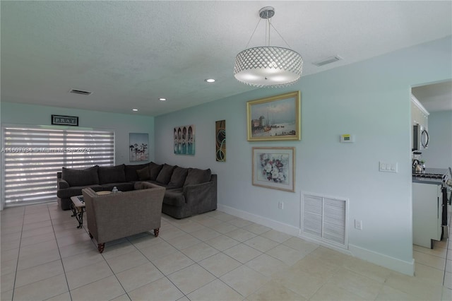 tiled living room with a textured ceiling