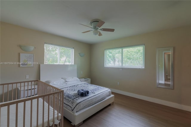 bedroom featuring ceiling fan and hardwood / wood-style flooring