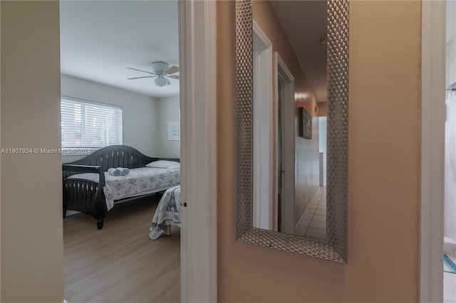 bedroom featuring ceiling fan and light hardwood / wood-style flooring