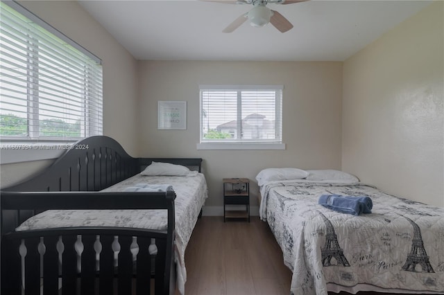 bedroom with wood-type flooring and ceiling fan